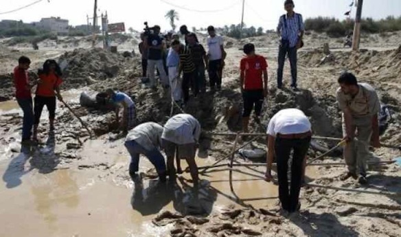 Palestinians search for bodies in the southern Gaza Strip, at a beach cafe hit the night before by an Israeli air strike: July 10, 2014 
