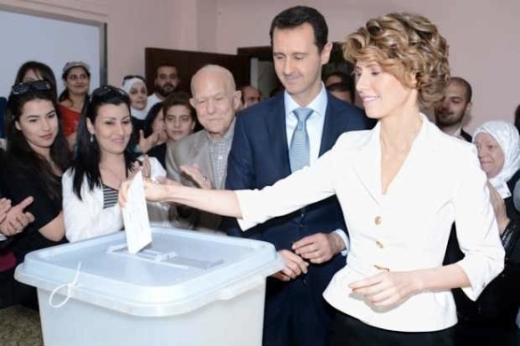 They all look so secular: this must be freedom! Bashar al-Assad and wife Asma vote in presidential election, 2003. Photo by Getty